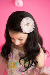 Baby pink circular hair accessory